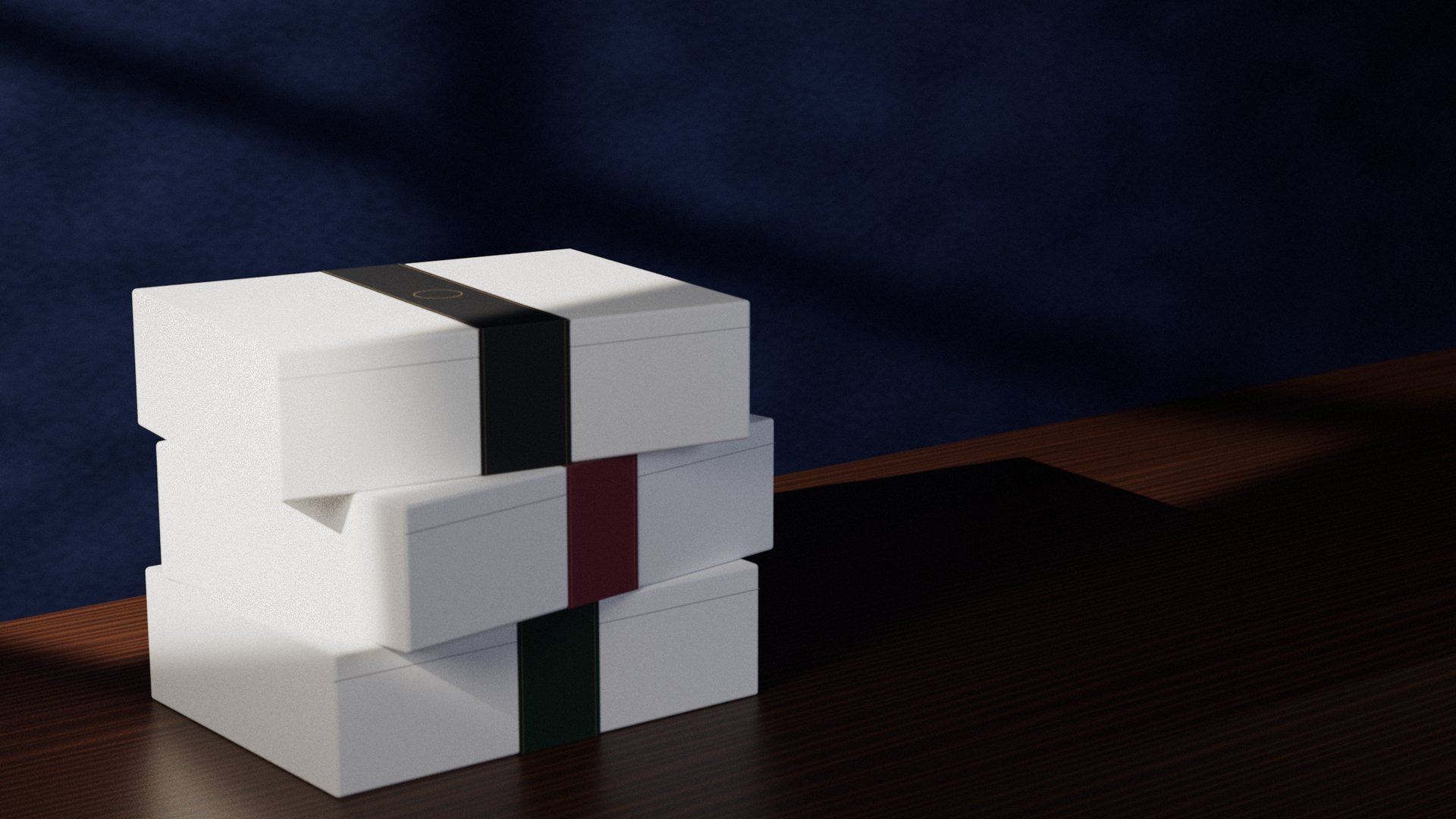Three white Pactis gift boxes stacked on a walnut sideboard, wrapped in forest green, claret and charcoal belly bands, each with a brass ring ready for a client's mark